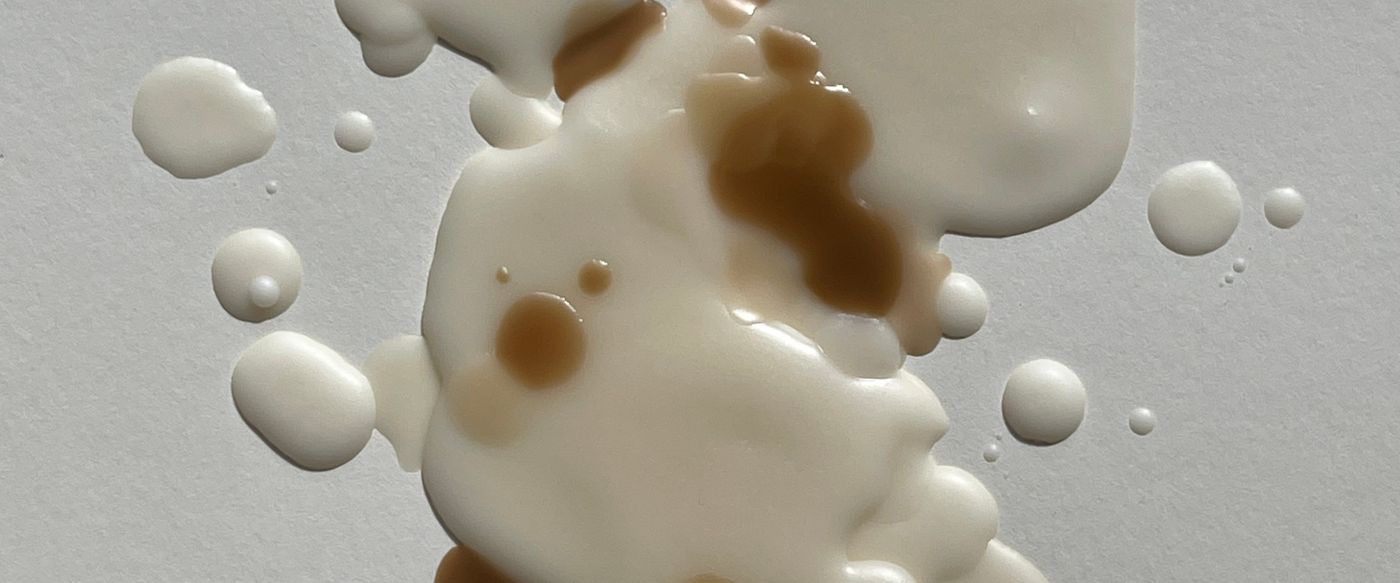 Close up of the last of the melted wax in the bottom of a candle jar