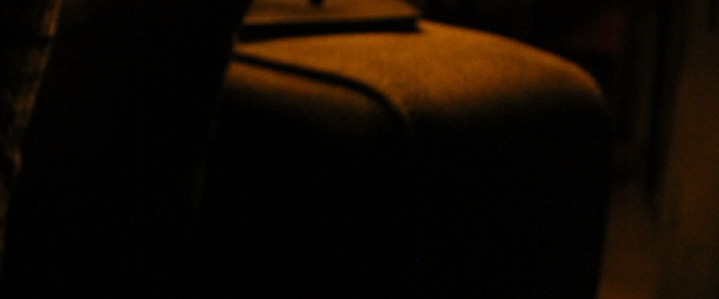 Coffee mug in warm lamp glow, a calm evening to light a musk candle