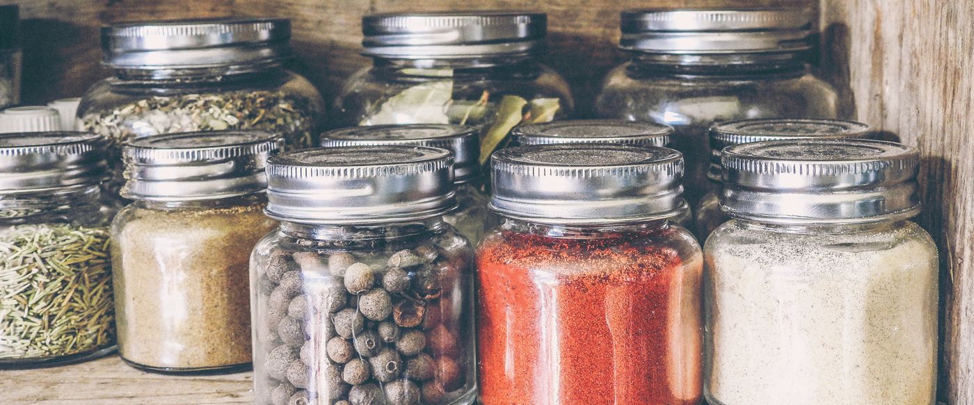 Glass jars on a rustic wooden shelf, a simple look for natural scented candles