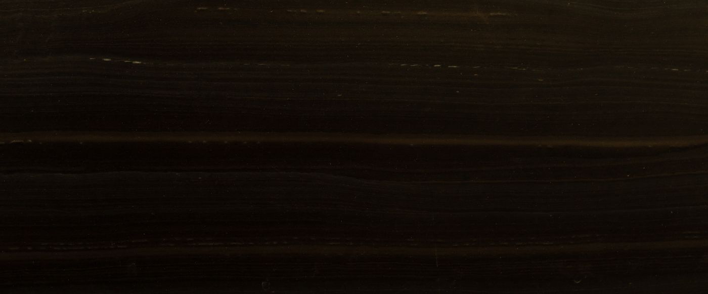 Close up of dark wood grain, the warm look of a sandalwood candle scent